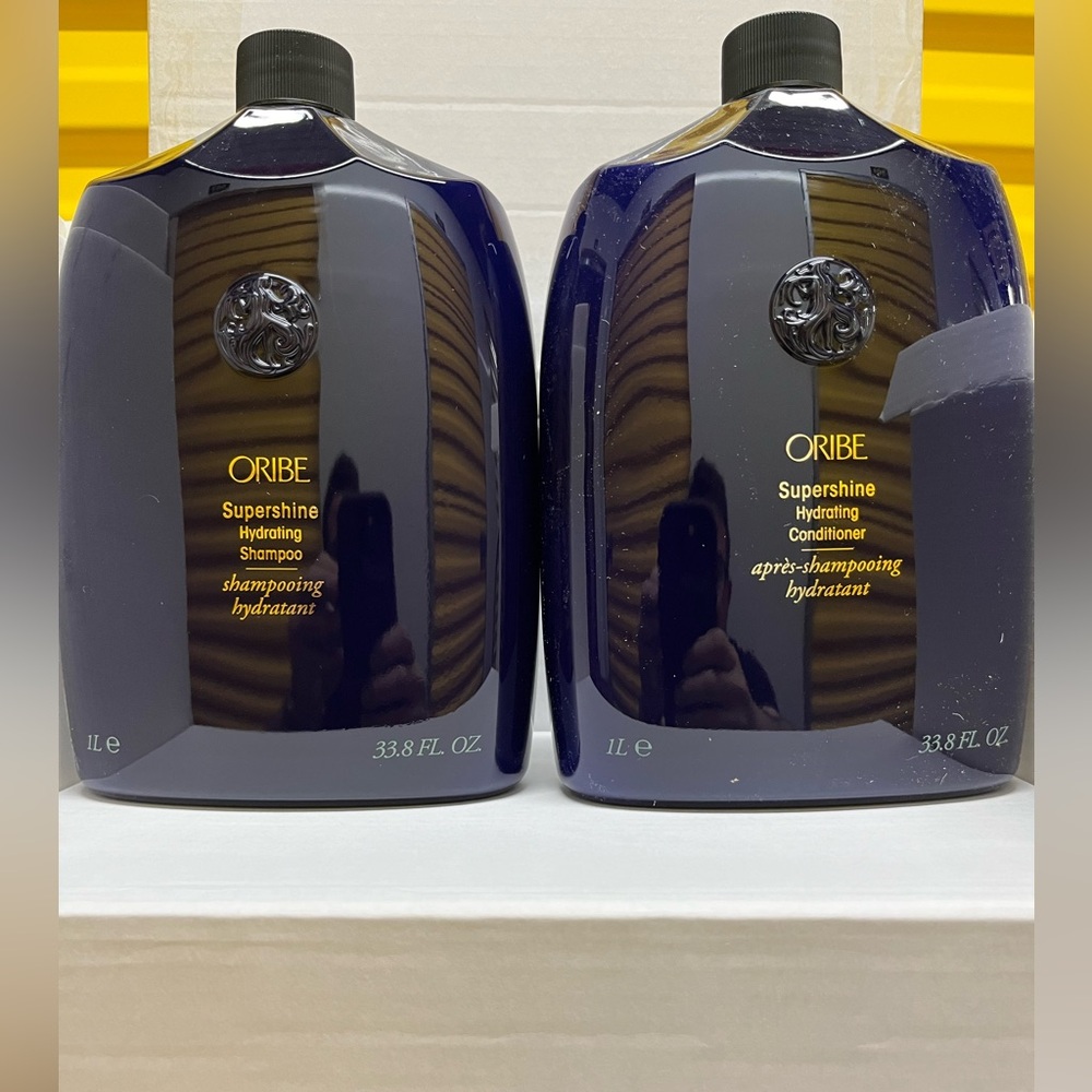 Oribe Supershine Hydrating Shampoo and Conditioner 33.8 oz with pumps.
